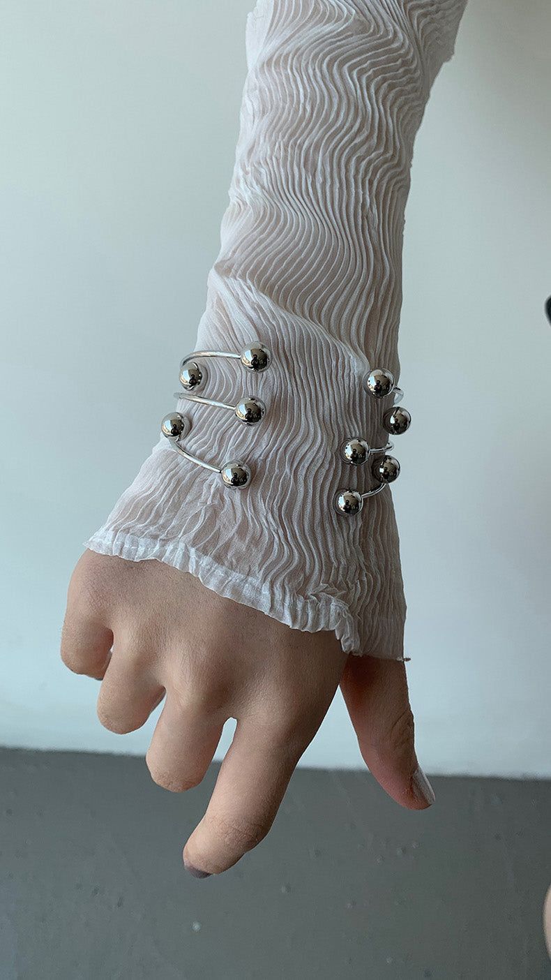 Silver ball piercing bangle