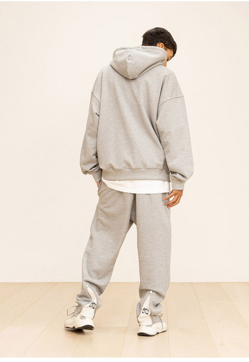 GRATING EMBLEM BACK SLIT ZIP PANTS
