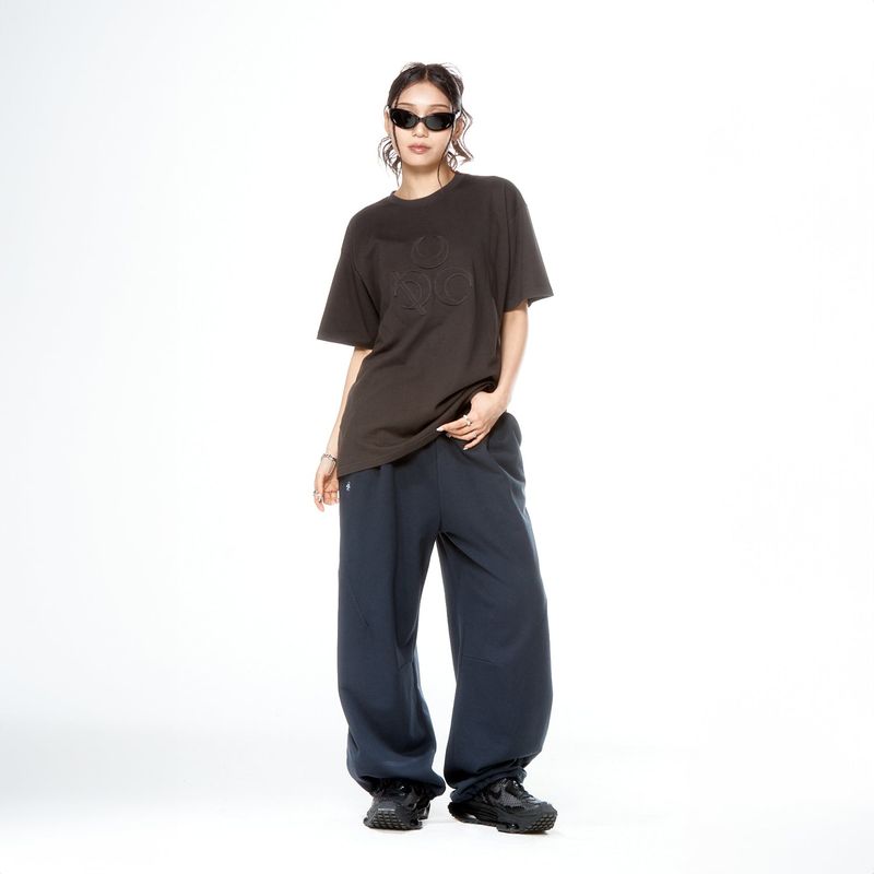 DAUSPICE(DUC)（ダウスピス）の「(DUC) Symbol Appliqué T-Shirt Charcoal（Tops）」