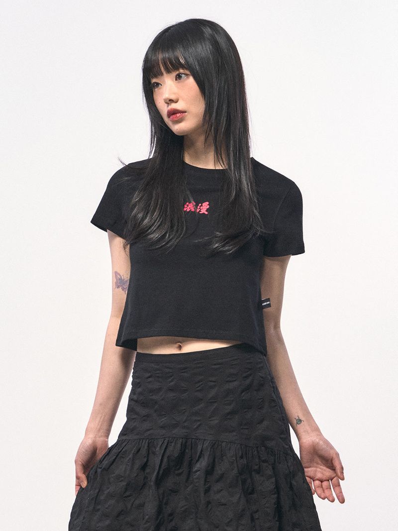 C Wear by the Genius(シーウェア バイザジーニアス)の「ROMANCE CROP T-SHIRT BLACK(Tops)」