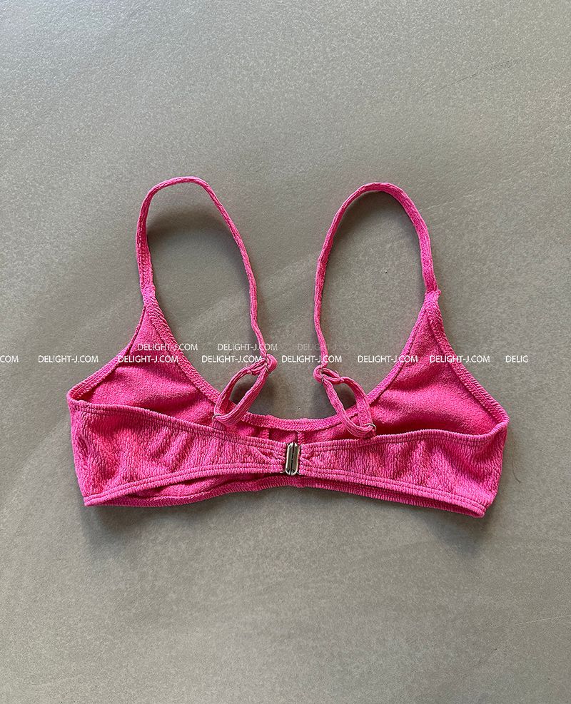 a set of 2 layered colored bikinis