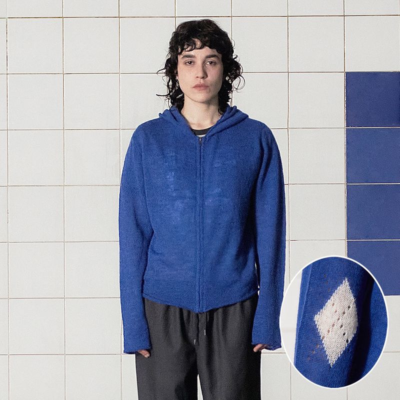 UNALLOYED(アナロイド)の「ARGYLE ELBOW KNIT ZIP-UP HOODIE / BLUE(Tops)」