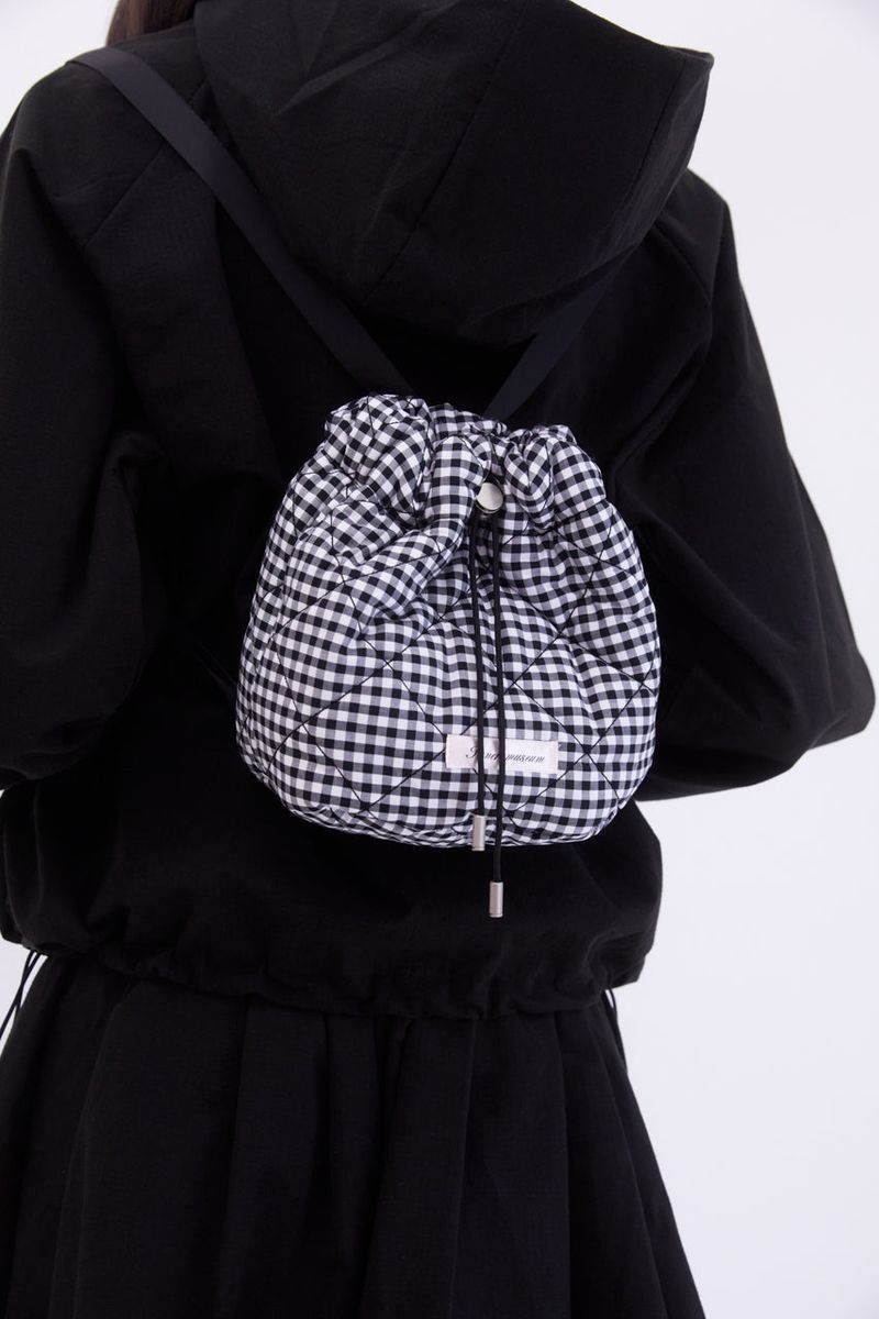 Innermuseum(インナーミュージアム)の「Gingham check string mini backpack (BLACK)(Bags)」