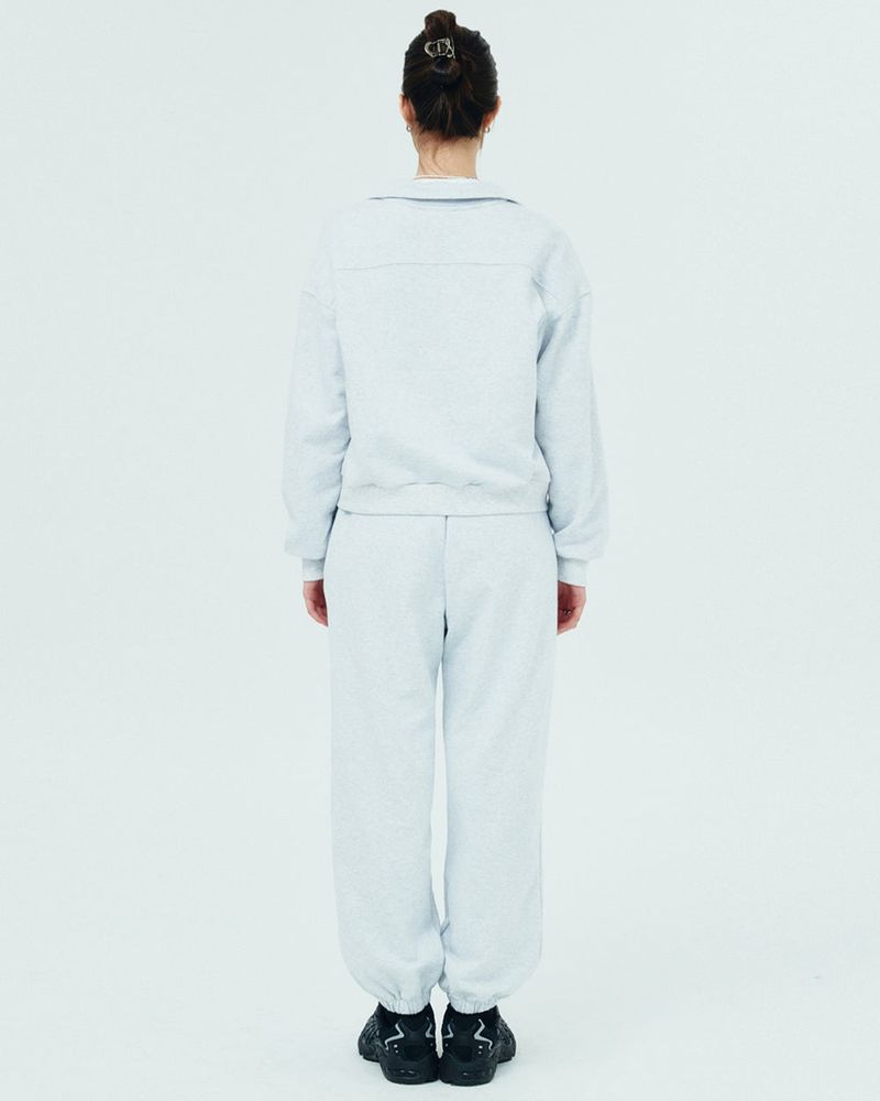 ROMAN TYPO LOGO TRAINING PANTS-WHITE MELANGE