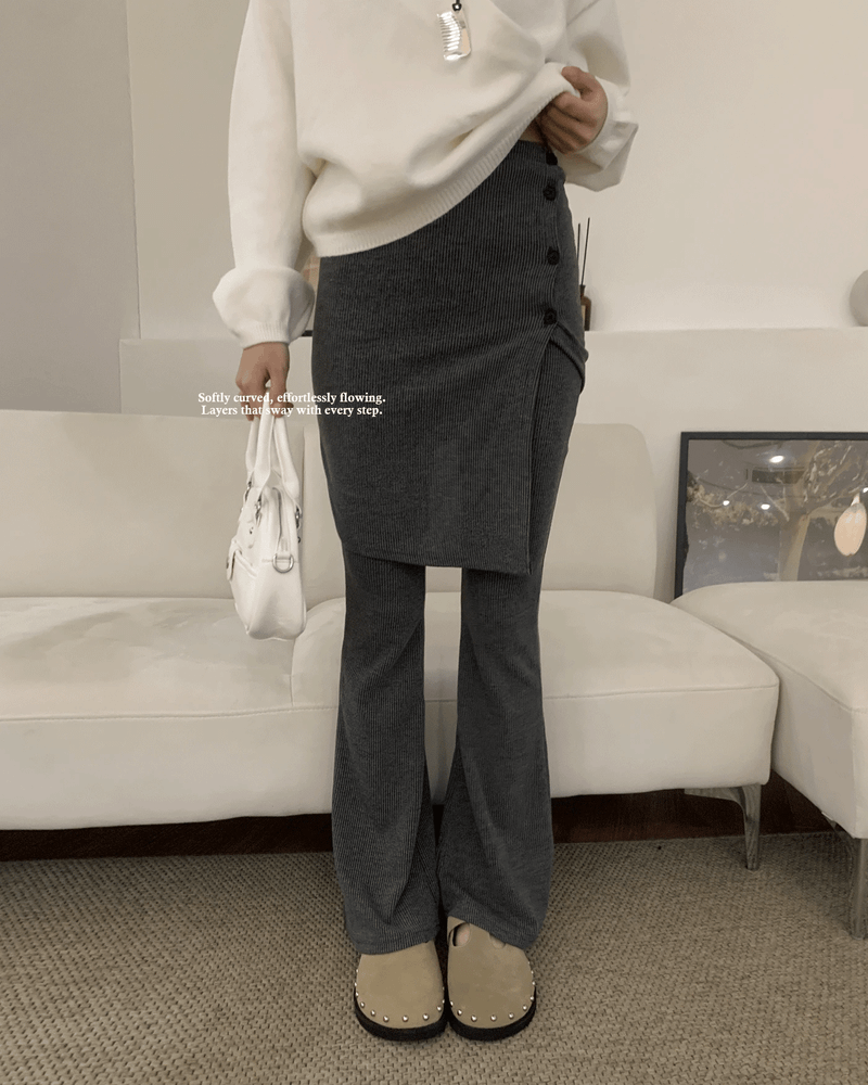 GUSTA（グスタ）の「Sway Unbalanced Wrap Button Ribbed Bootcut Pants（Pants）」