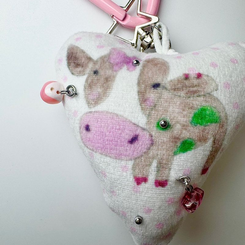 Pierced pinky cow keychain