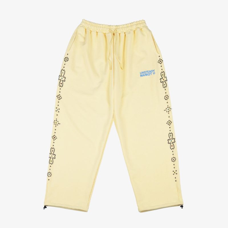 UNSTEADYMARKET（アンステディマーケット）の「ラインストーン スウェット パンツ レモン（パンツ）」
