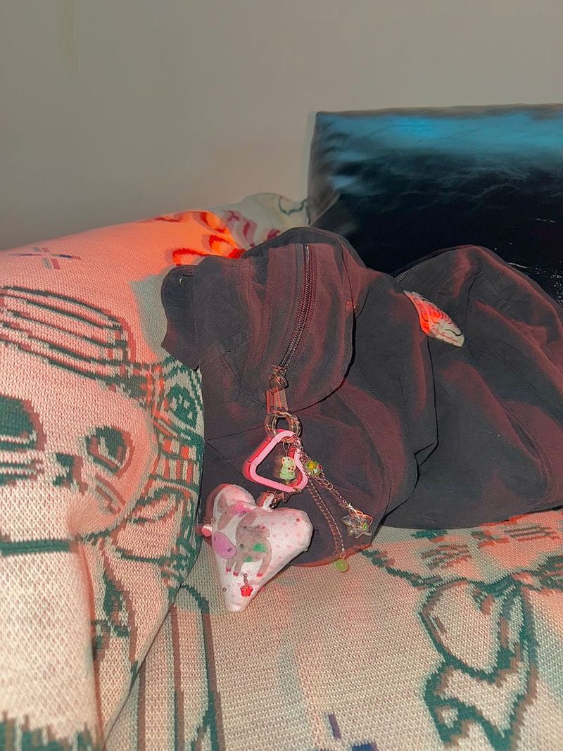 Pierced pinky cow keychain