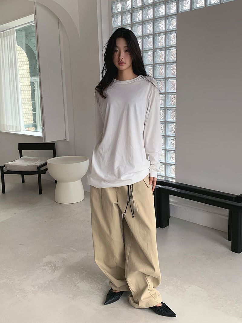 CURVED TUCK COTTON TROUSER