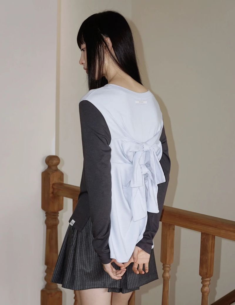 UGLYSHADOW（アグリーシャドウ）の「バック リボン ティーシャツ(CHARCOAL BLUE)（トップス）」