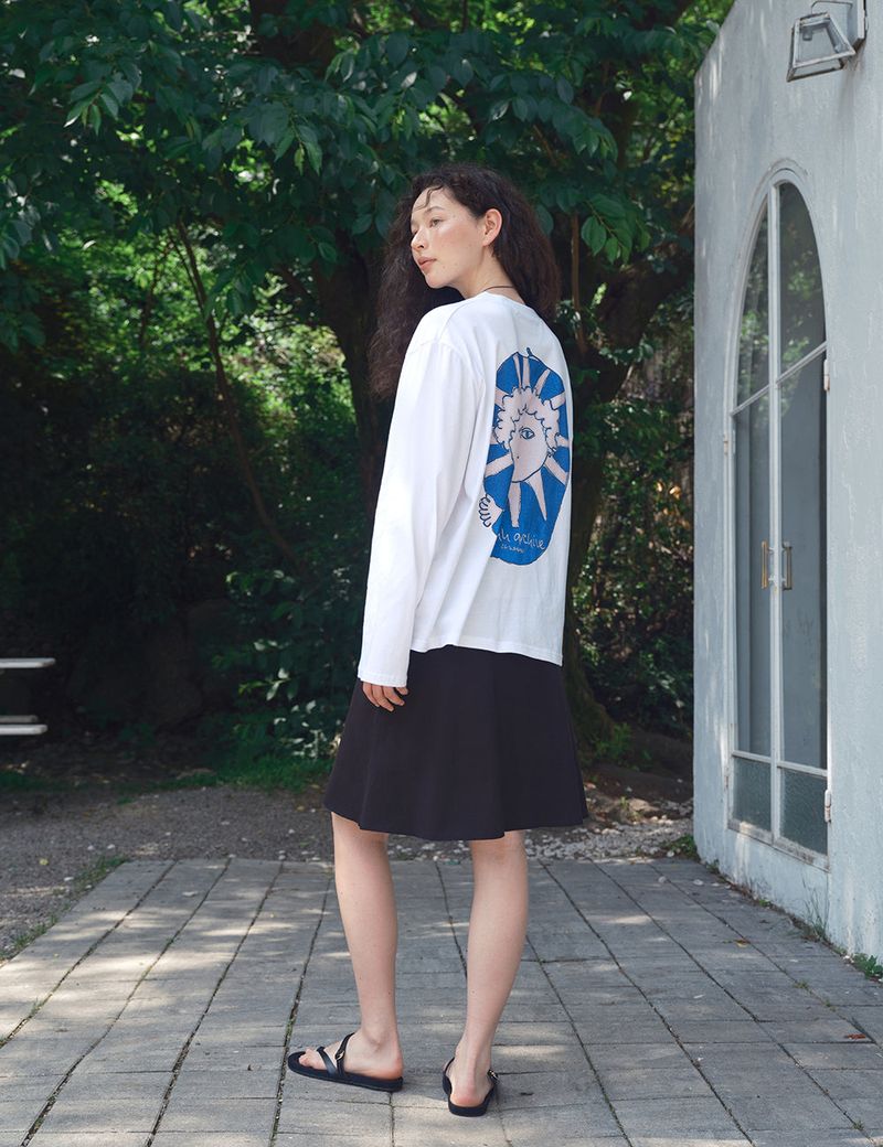 ORIGHH（オライ）の「Blue Sunface Printing Long Sleeve T-Shirt（Tops）」