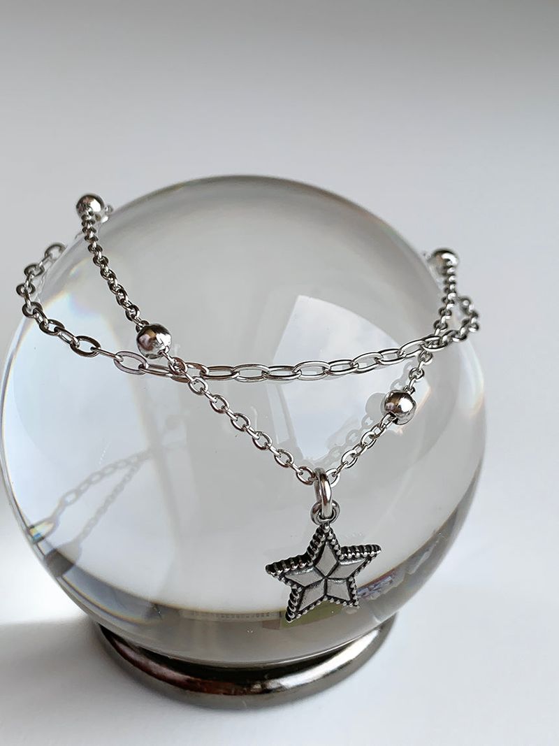 Two chain layered star bracelets