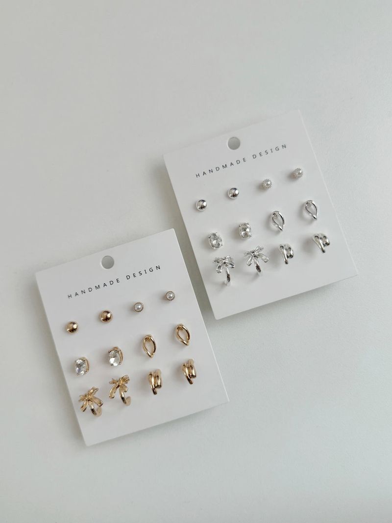 Blingmoon（ブリングムーン）の「[6 set]キュービックリボンムードイヤリングセット（アクセサリー）」