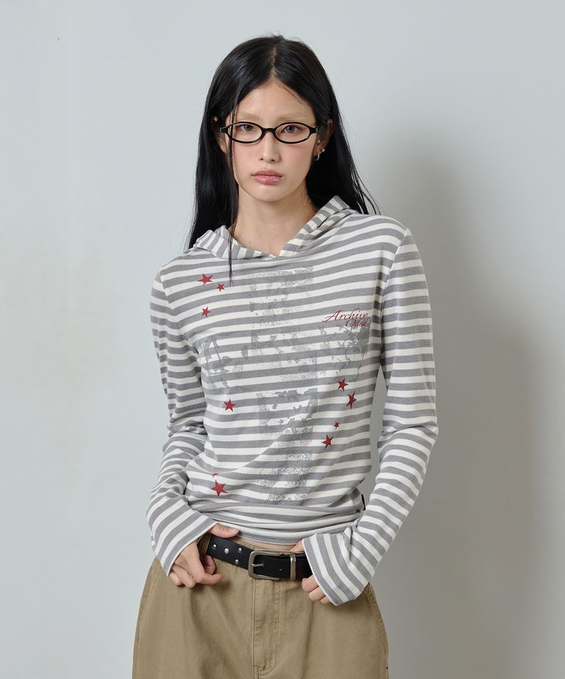 ODDSTUDIO（オッドスタジオ）の「Cross Star Graphic Stripe Hooded Long Sleeve - GRAY（Tops）」