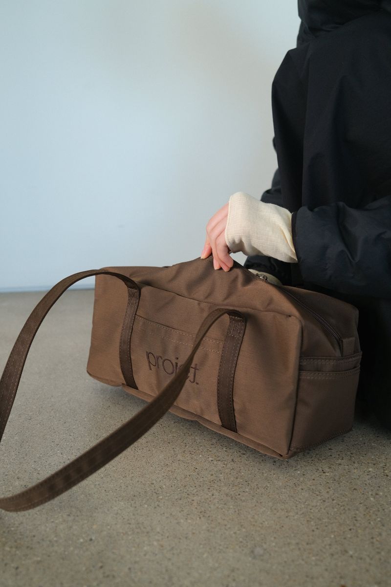 projet（プロジェ）の「compact duffle bag (brown)（Bags）」