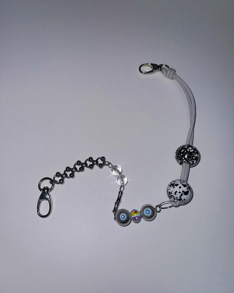Pierced ball bag chain