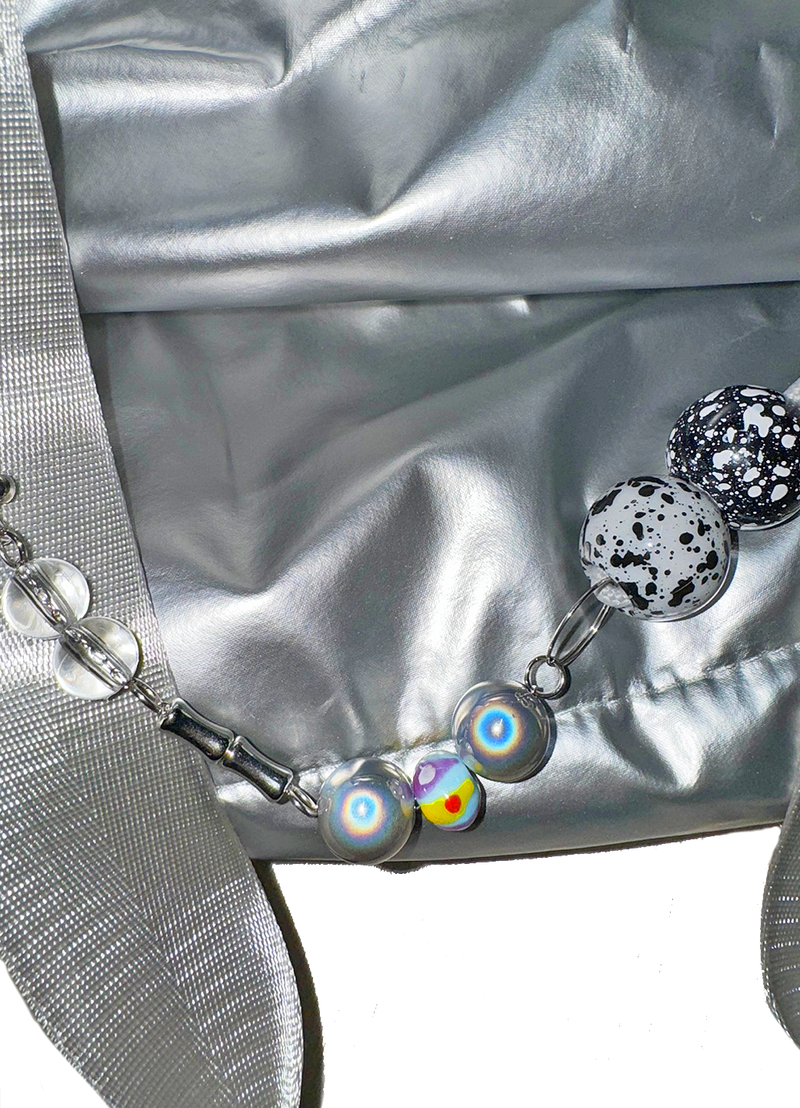 Pierced ball bag chain