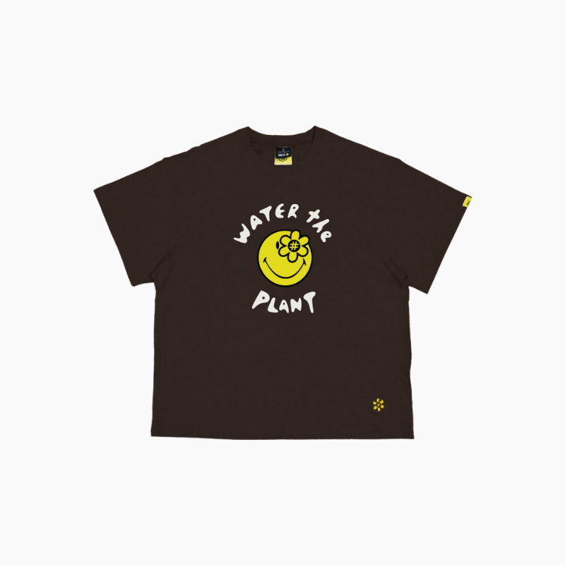 Water The Plant(ウォーターザプラント)の「SMILEYWORLD® CHEERS TSHIRT | BROWN(Tops)」