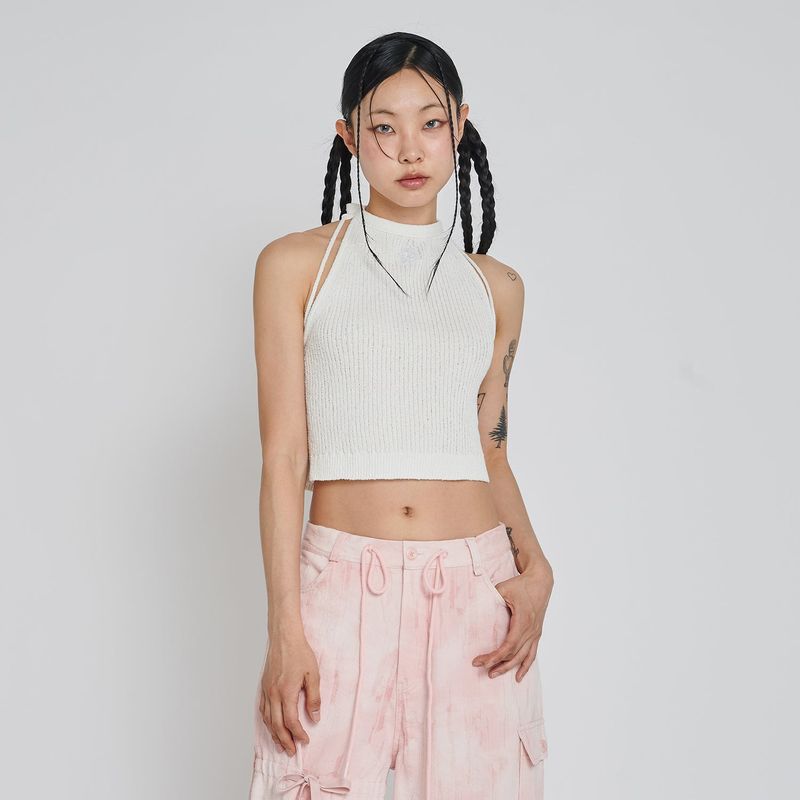 UNUSUALNORMAL（アンユージュアルノーマル）の「BOOKLE HALTER KNIT TOP_IVORY（Tops）」