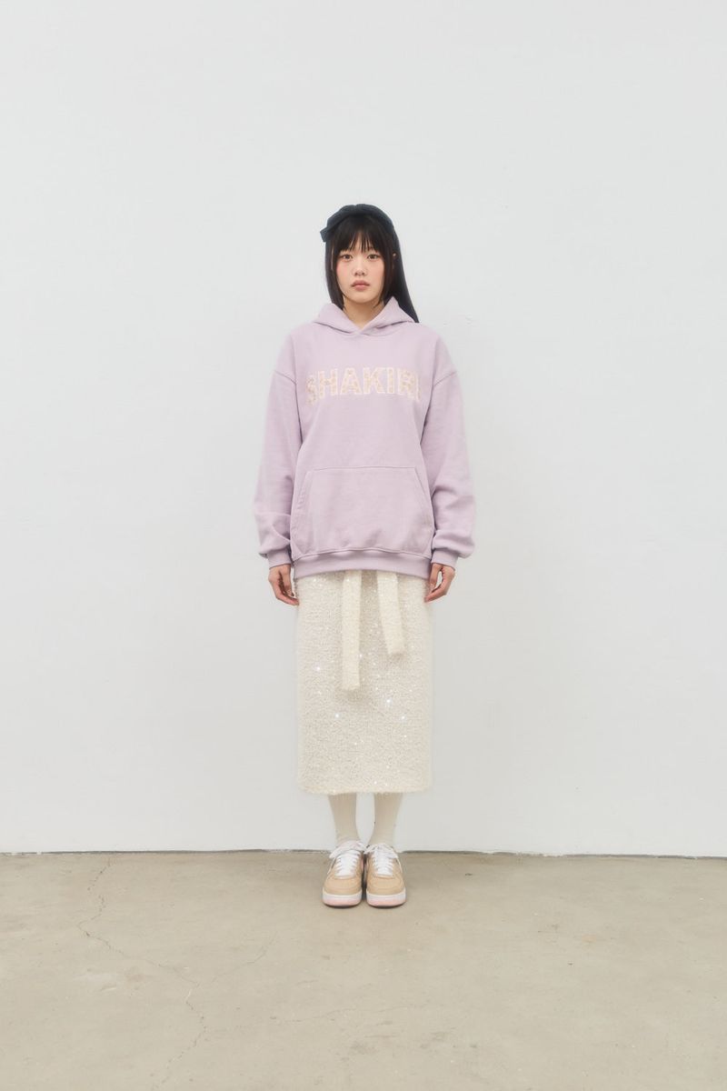 SHAKIRI(シャキリ)の「GLITTER SPANGLE KNIT SKIRT (CREAM)(Skirts)」