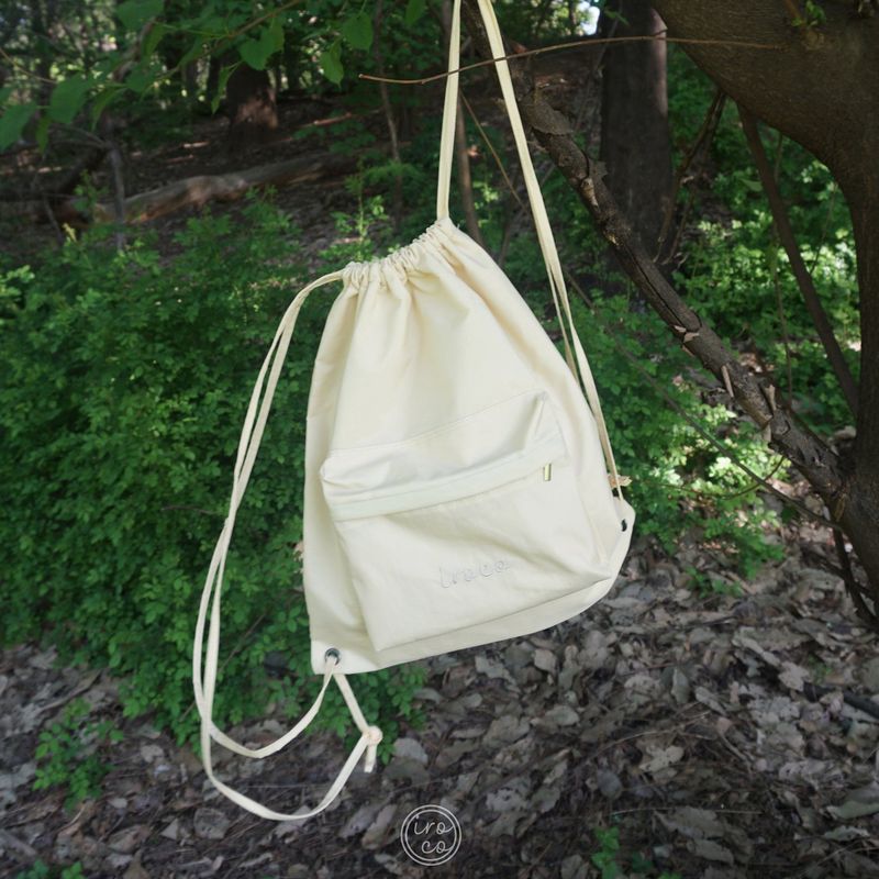 Iroco（イロコ）の「logo nylon string backpack_yellow（Bags）」