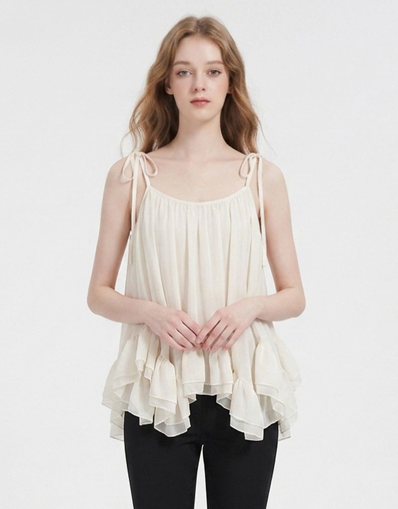 TWEEDY-A（ツウィーディア）の「ヘーゼルシアーリボンストラップフリルスリーブレス Ivory（トップス）」
