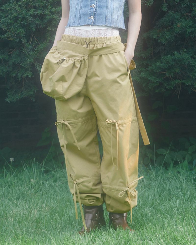 ZIZEMUSEUM(ジゼミュージアム)の「 RIBBON STRING PANTS .WITH BAG (BEIGE)(Pants)」