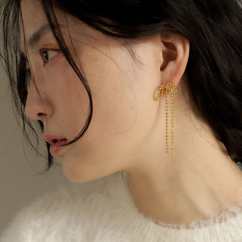 geegee(ジジ)の「holi long ribbon earring - gold(Accessories)」