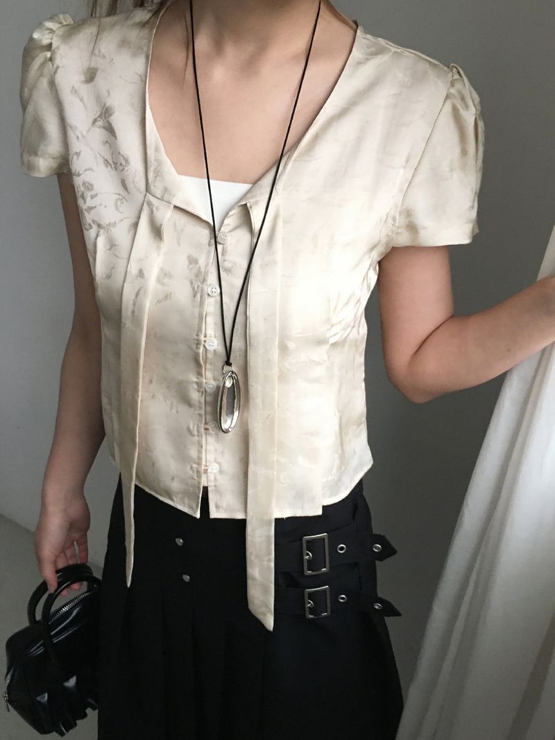Jacquard tie puff blouse