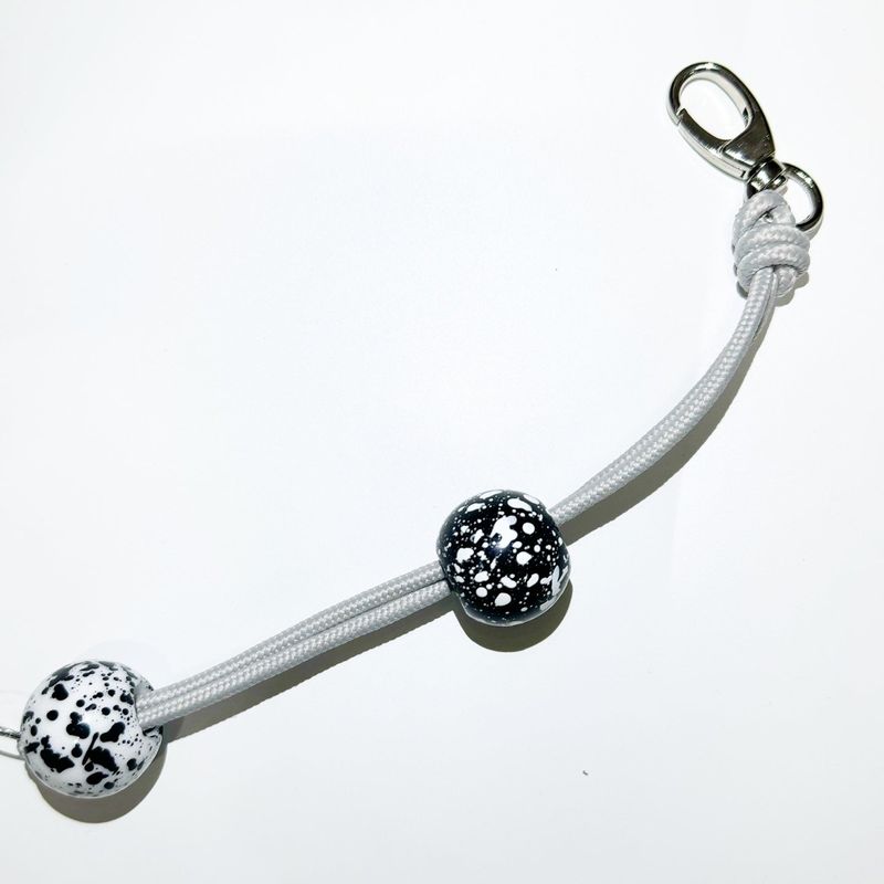 Pierced ball bag chain