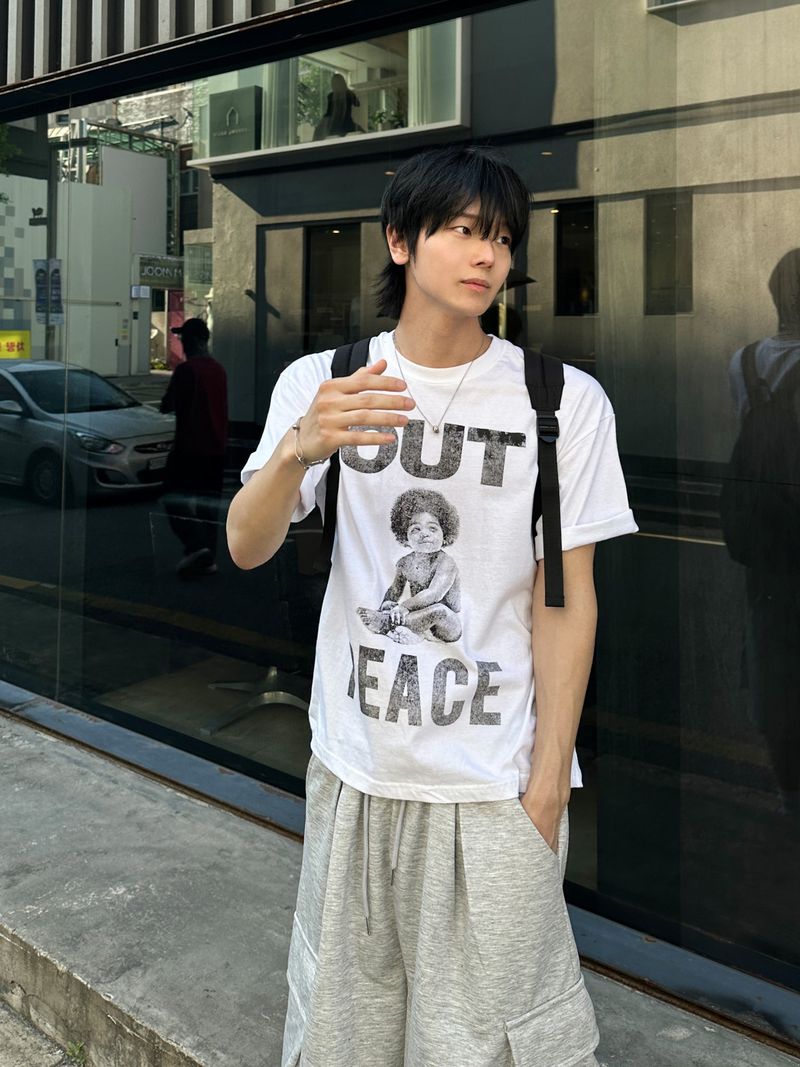 WHAT A LOOK（ワット ア ルック）の「Lumen Afro Graphic Print T-Shirt（Tops）」
