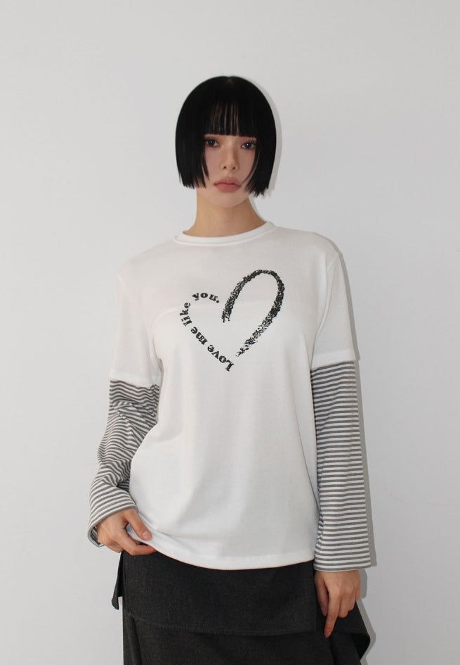AAKE(アケ)の「(Brushed) HEART LAYERED LONG-SLEEVE(Tops)」