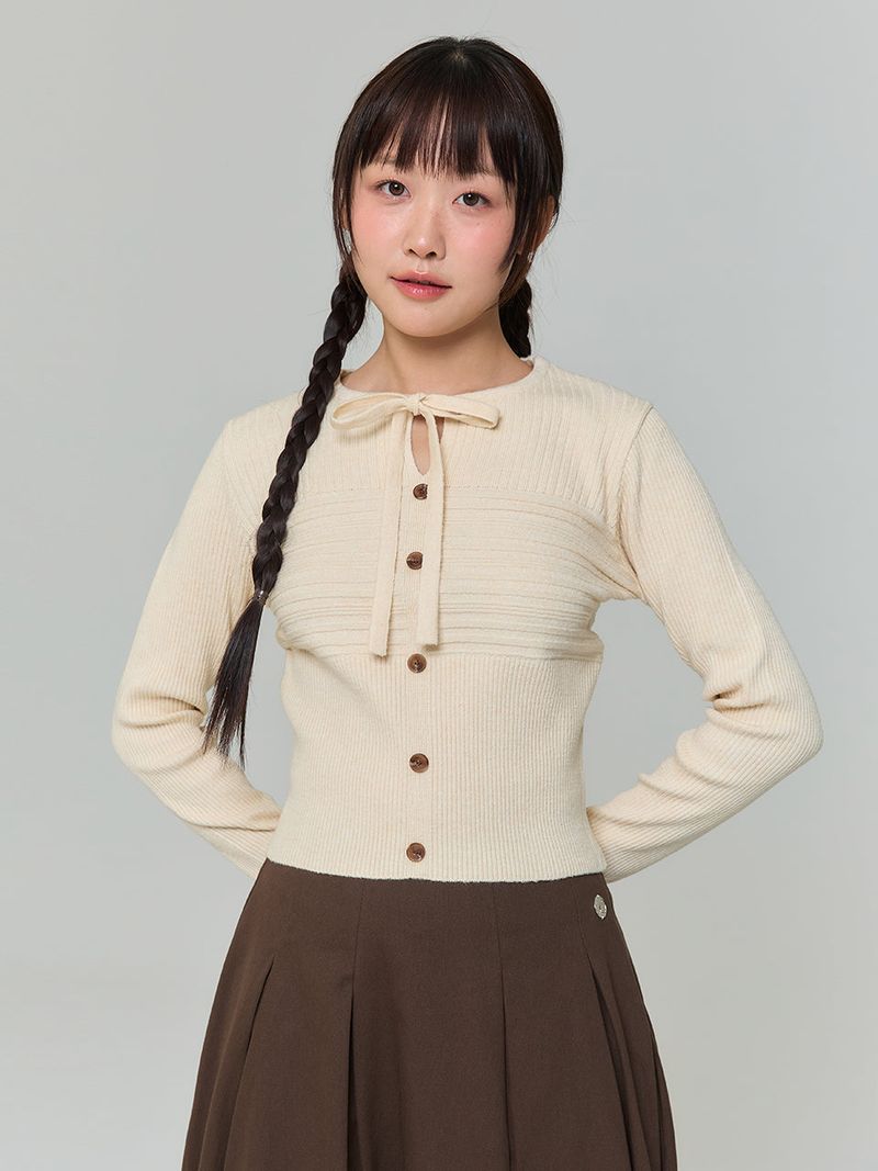 ADORE BELLE(アドールベル)の「RIBBON BUTTON SILM KNIT - BUTTER(Tops)」