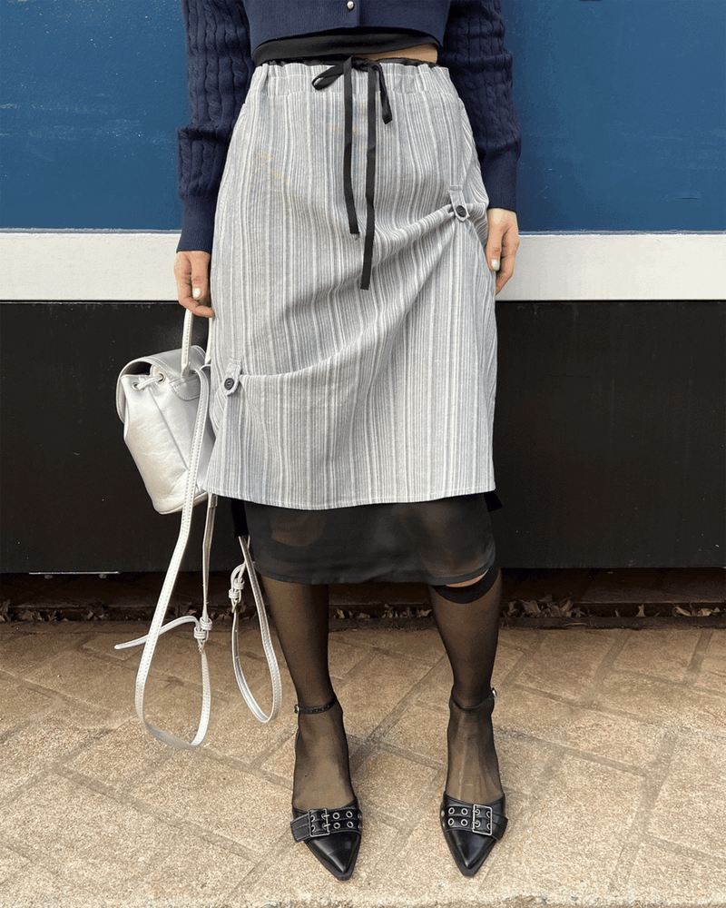 GUSTA（グスタ）の「 Oblique Noir Visor Stripe See-through Midi Skirt (2 colors)（Skirts）」