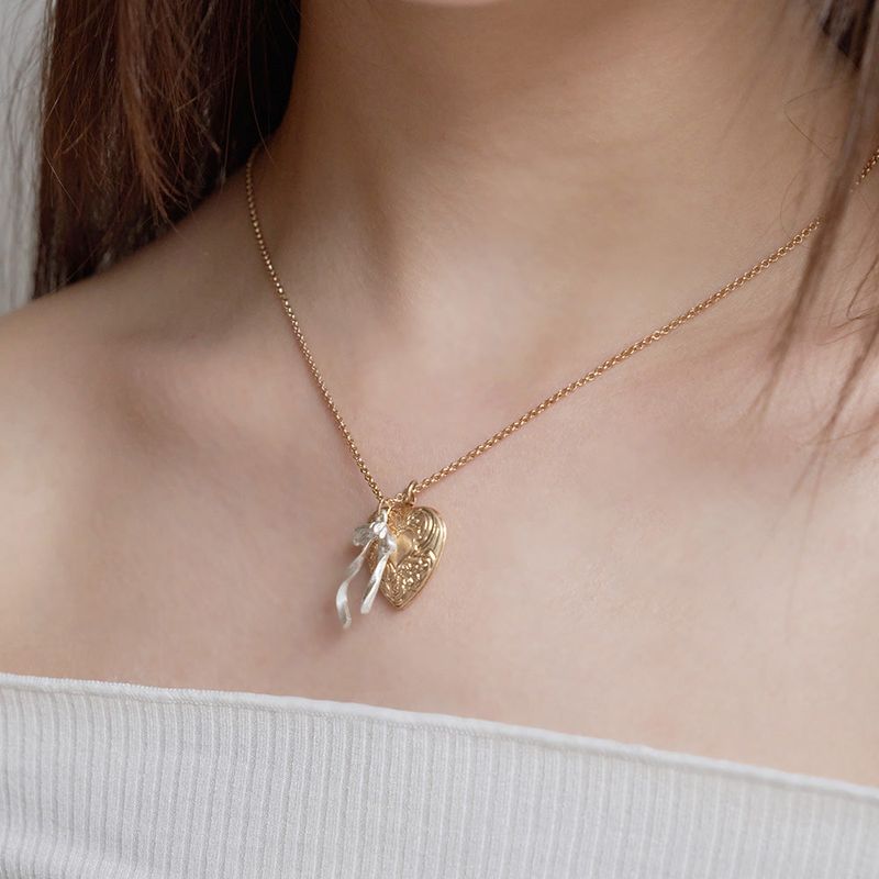 OVT-U（オーブイティーユー）の「Heart Rocket & Flow Ribbon Necklace（Accessories）」