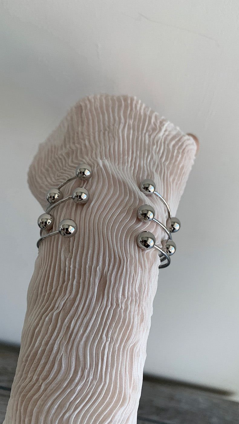 Silver ball piercing bangle