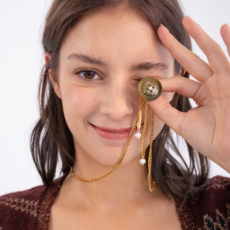 MerryMotive(メリーモチーブ)の「Button point bolo tie chain necklace (Khaki)(Accessories)」