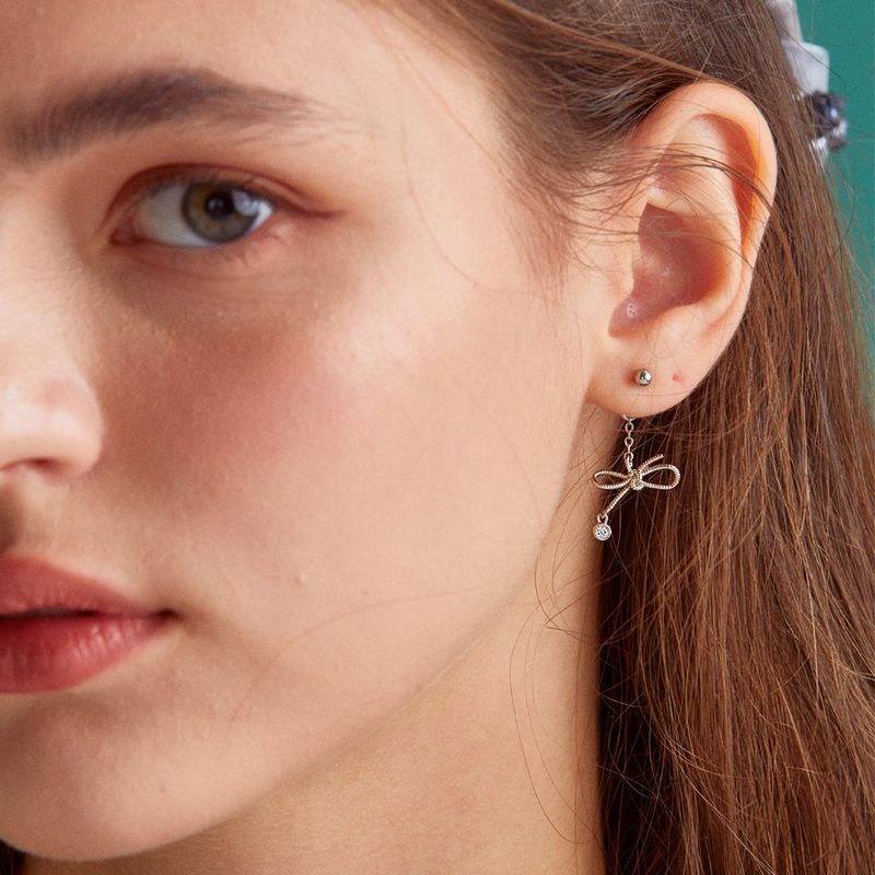 MerryMotive(メリーモチーブ)の「Knot ribbon drop surgical earring(Accessories)」