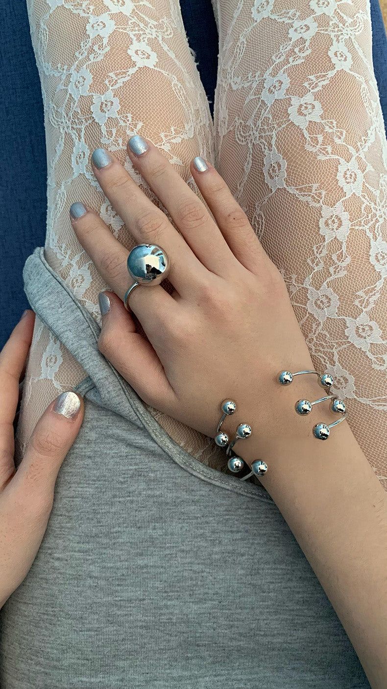 Silver ball piercing bangle