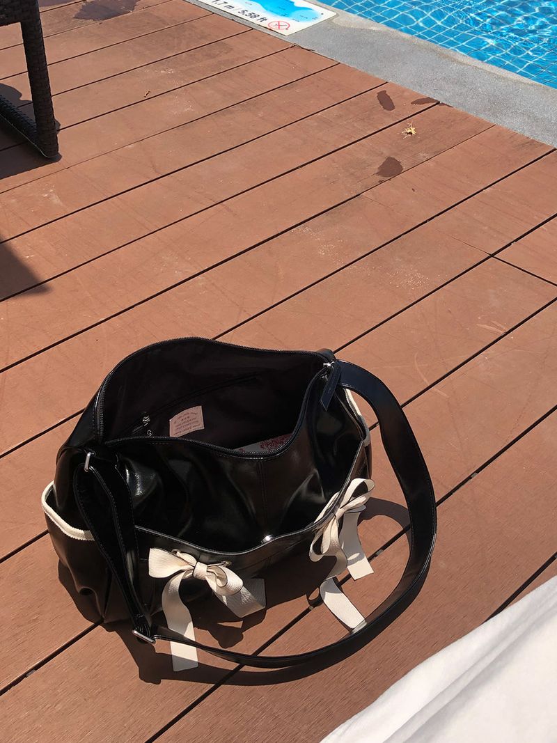 ovuni（オーブニ）の「Ribbon duffel bag_black（Bags）」
