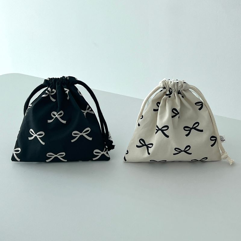 munggle market（ムングルマーケット）の「リボンストリングポーチ（スマホグッズ/小物）」