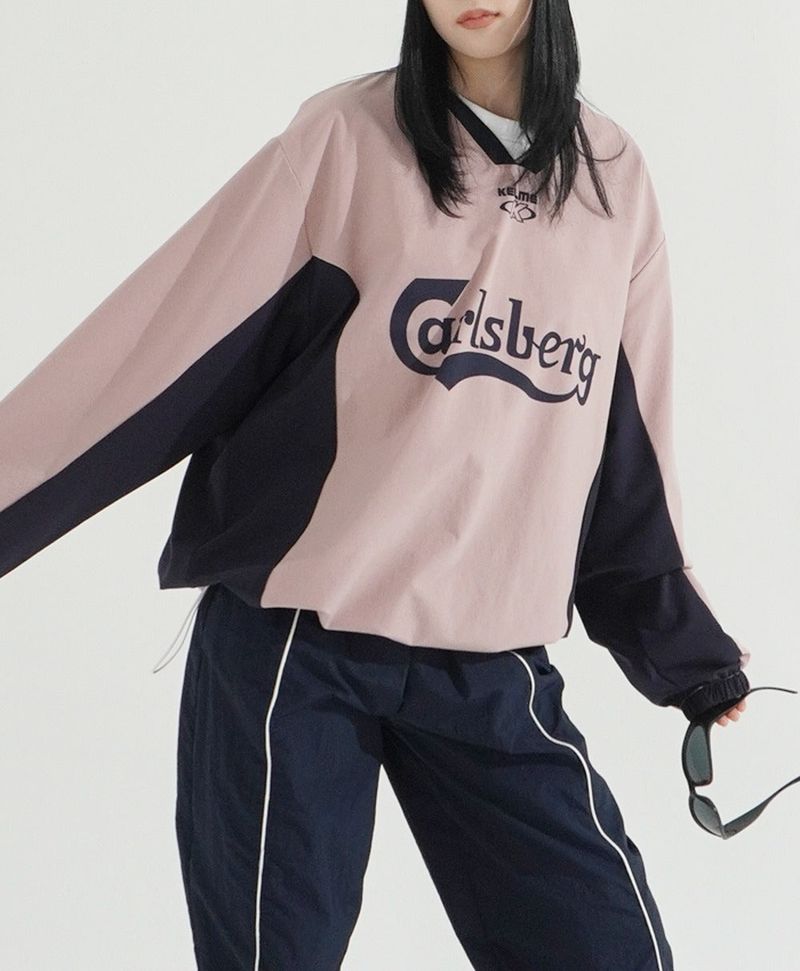 KIXI（キッシー）の「スポーティストリングVネックナイロンスウェットシャツ（トップス）」