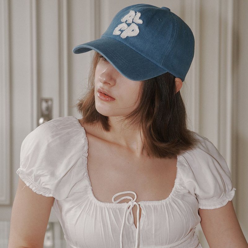 ALLINCOMPLETE（オールインコンプリート）の「ALCP アップリケウォッシュドボールキャップ (Blue Denim)（帽子）」