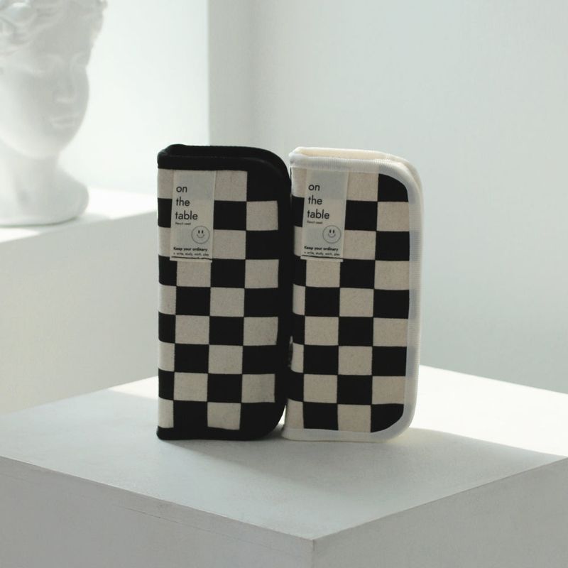 On the table pen case (checkerboard)