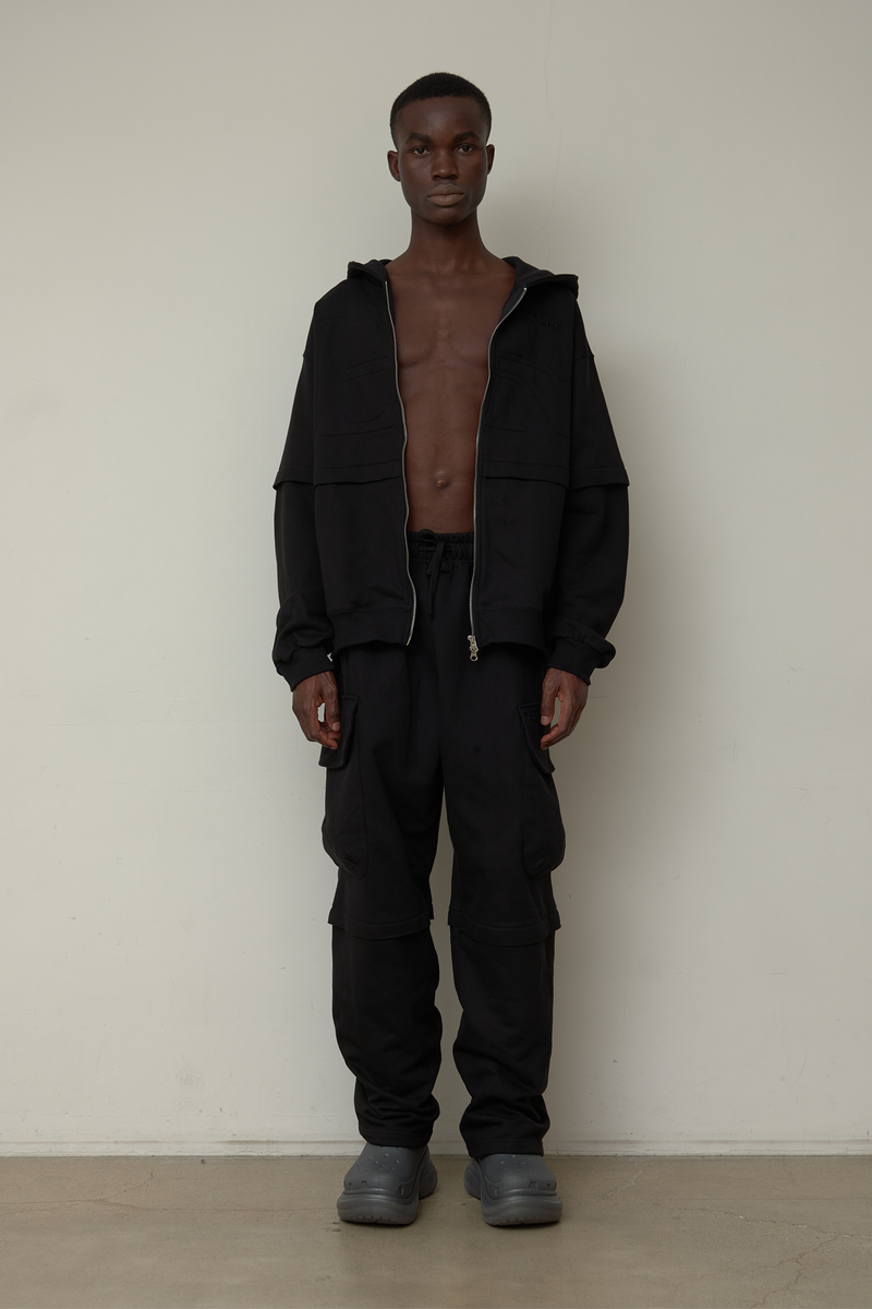 ER(EEERRR)（イーアール）の「Back point shirring hood zip-up (Black)（Tops）」