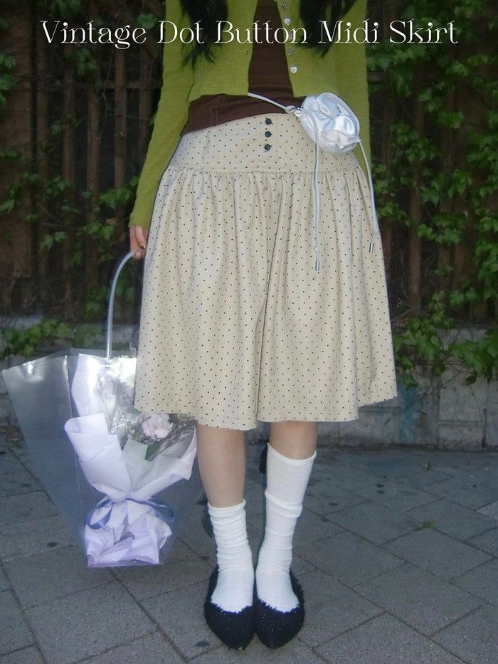 onthenextpage（オンザネクストページ）の「Vintage Dot Button Midi Skirt（Skirts）」