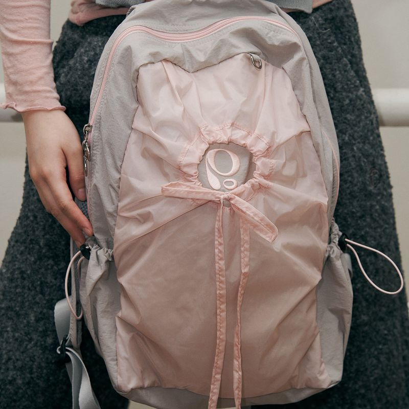 poie（ポイエ）の「hole string po backpack (pink grey)（Bags）」