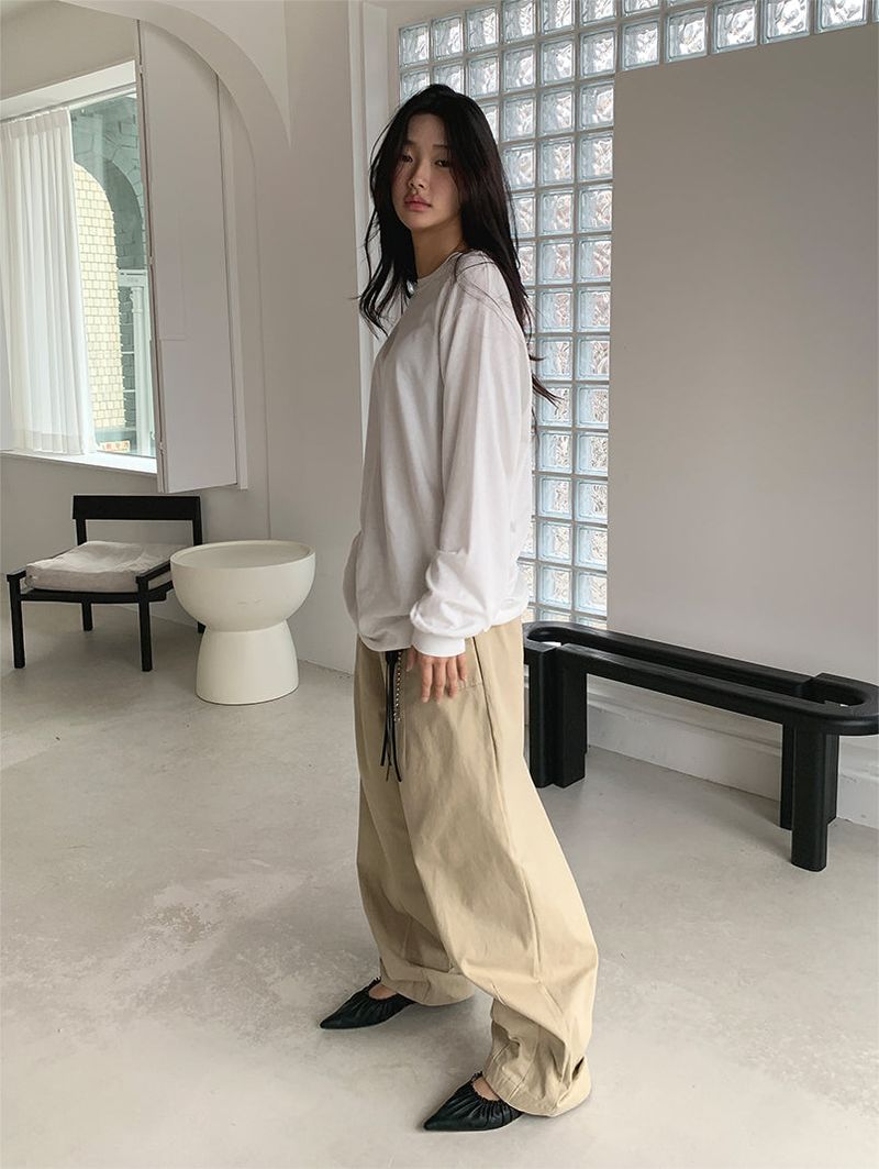 CURVED TUCK COTTON TROUSER
