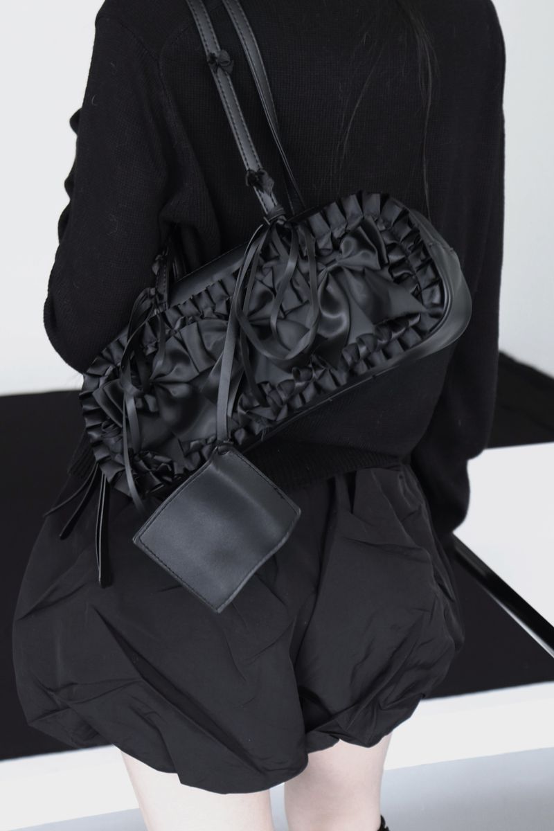 black leather ribbon bag