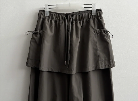 Log banding layered pocket skirt pants